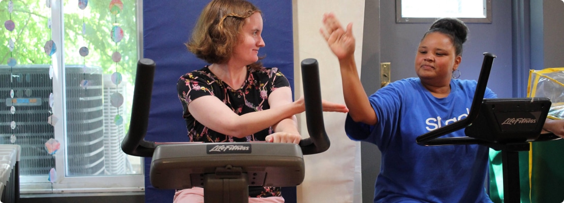 women on cardio machines